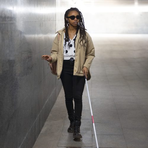 full-shot-woman-walking-with-white-cane