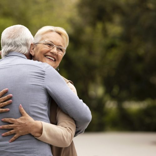 medium-shot-man-woman-hugging-outdoors